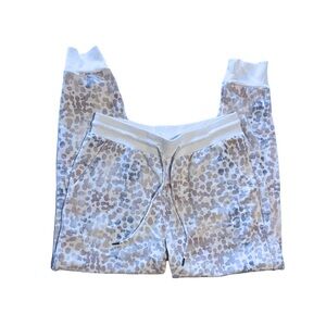 Stars Above pajama joggers with blue, purple, and pink ombré leopard print